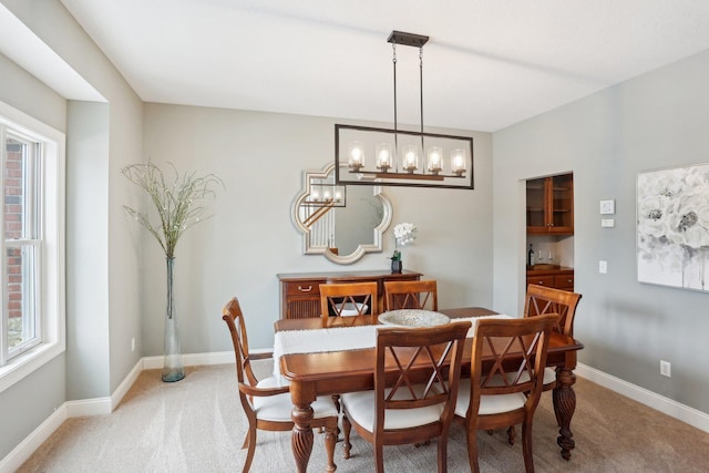 dining room featuring carpet flooring