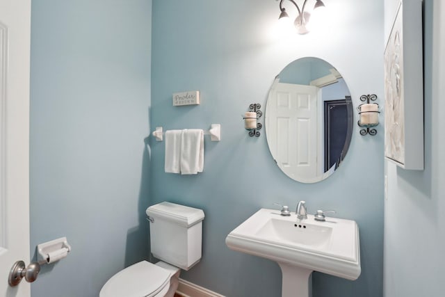 bathroom featuring sink and toilet