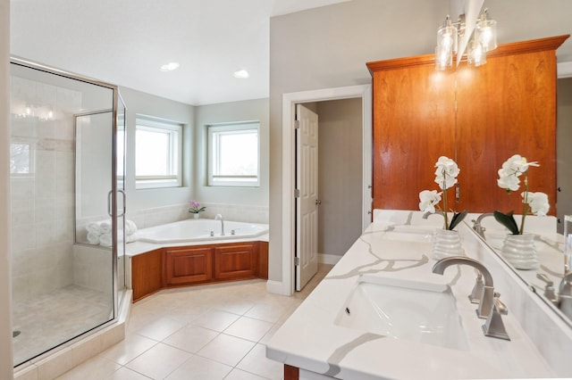 bathroom with tile patterned flooring, shower with separate bathtub, and vanity