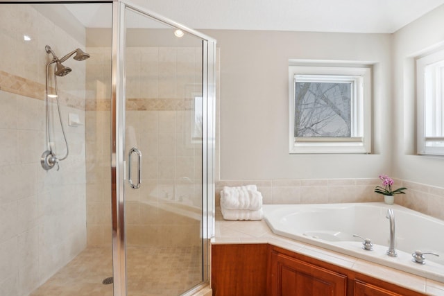 bathroom featuring plus walk in shower