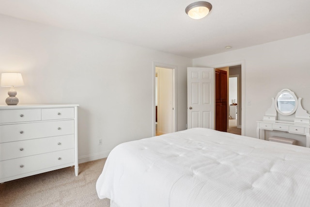 bedroom featuring light carpet