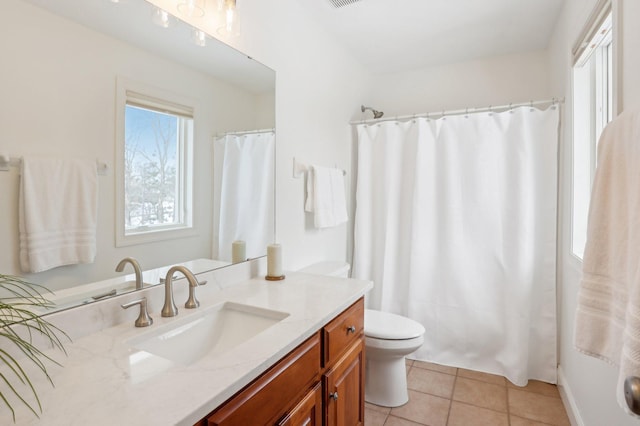 bathroom with vanity, tile patterned floors, and toilet