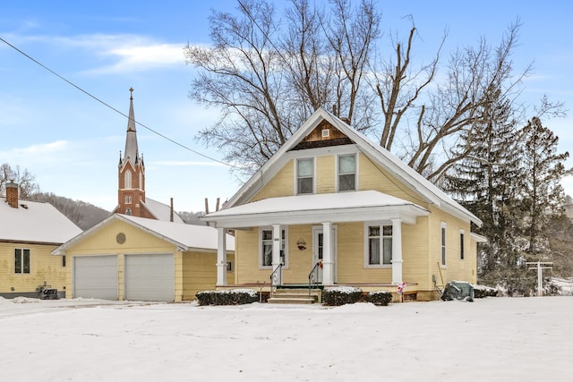 view of front facade featuring a garage and covered porch