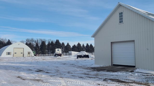 exterior space with an outbuilding and a garage