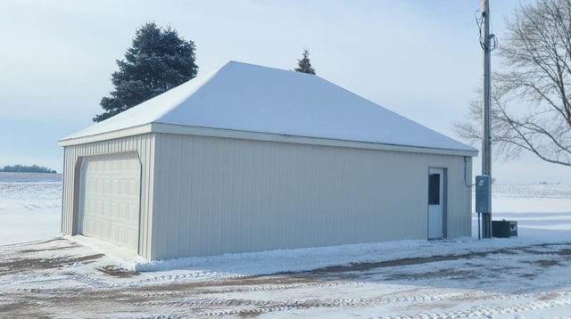 view of snow covered garage