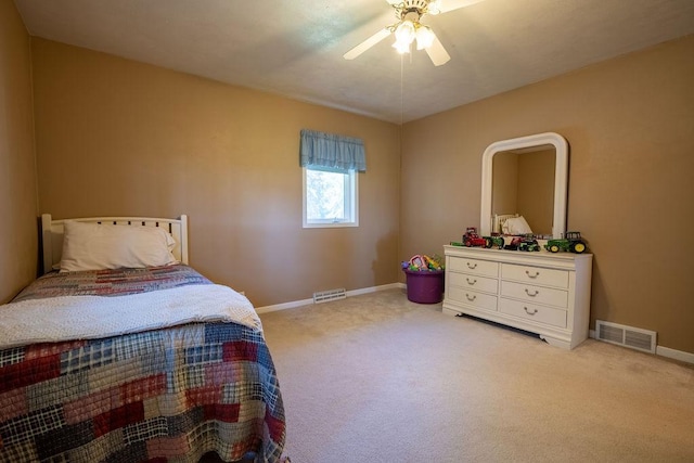 bedroom with light carpet and ceiling fan