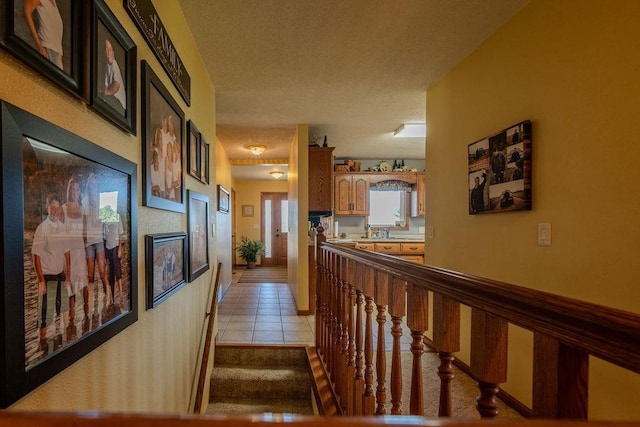 corridor featuring light tile patterned flooring