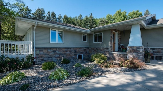 view of side of home featuring a porch