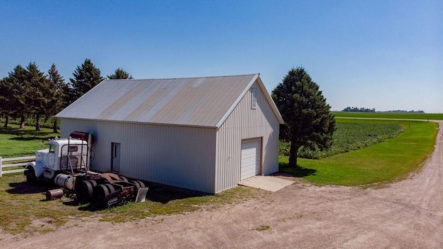 garage featuring a rural view