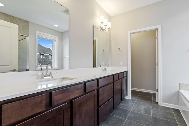 bathroom with vanity, plus walk in shower, and tile patterned flooring