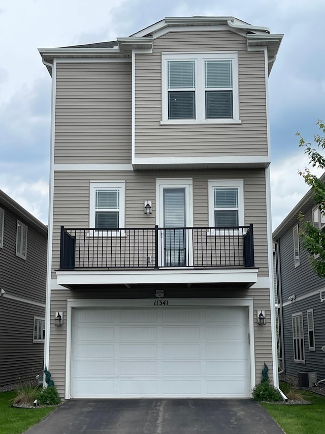 11341 81st Way N, Maple Grove, MN 55369 - view of front of property with an attached garage, a balcony, and driveway