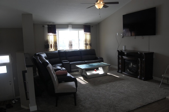 carpeted living room featuring vaulted ceiling and ceiling fan