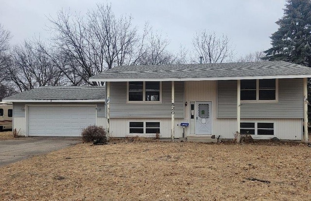 split foyer home featuring a garage