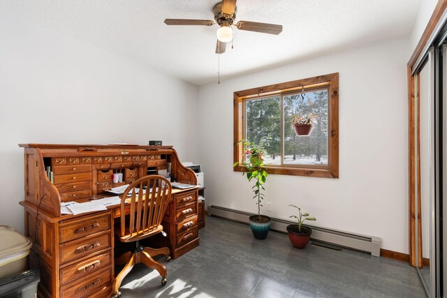 office area with a textured ceiling, baseboards, a baseboard heating unit, and ceiling fan