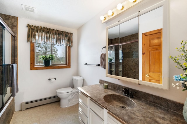 bathroom featuring visible vents, toilet, vanity, baseboard heating, and tiled shower / bath