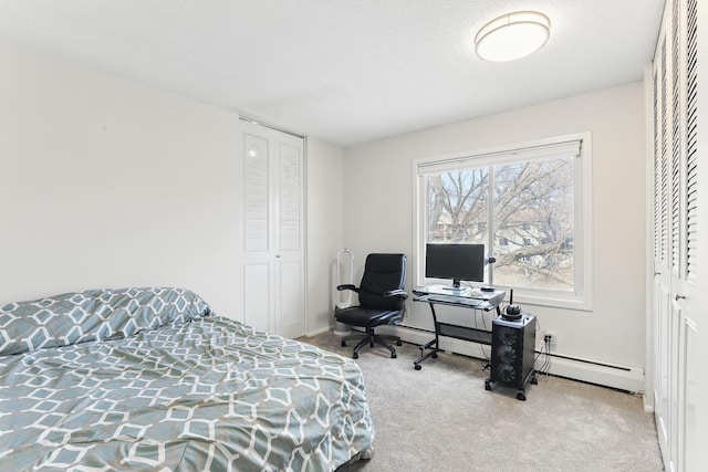 bedroom featuring a baseboard radiator, carpet, and a closet