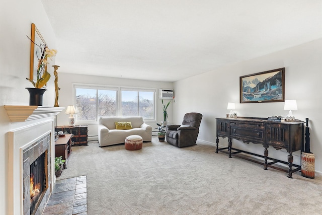 carpeted living room with baseboards, a wall unit AC, and a premium fireplace