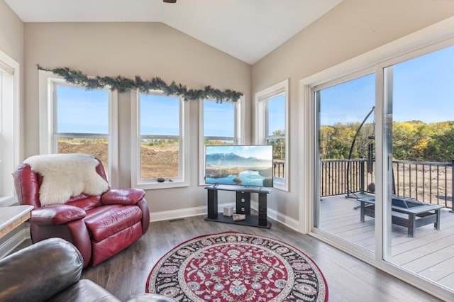 sunroom with visible vents and vaulted ceiling