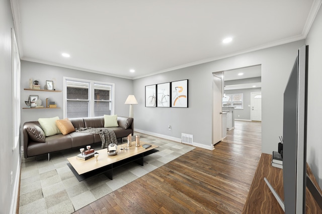 living room with hardwood / wood-style floors and ornamental molding