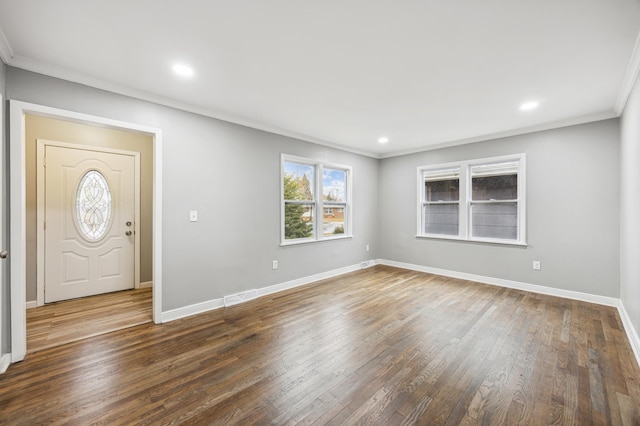 entryway featuring crown molding and dark hardwood / wood-style floors