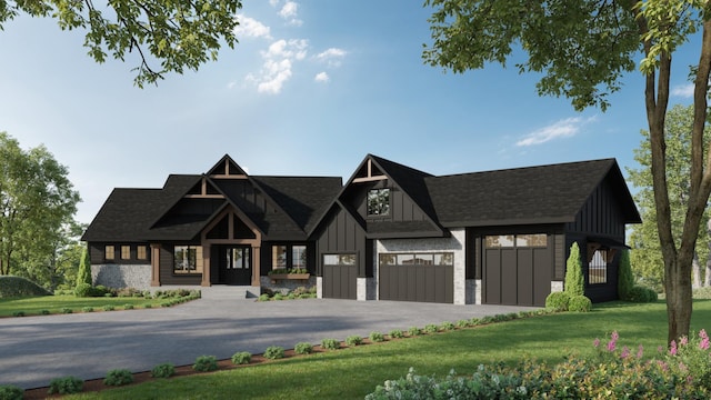 view of front of property featuring a garage and a front yard