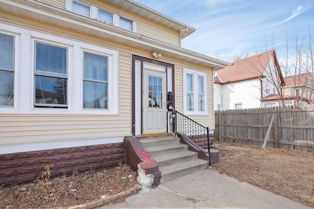 doorway to property with fence