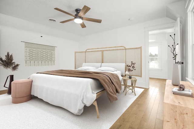 bedroom featuring hardwood / wood-style flooring and ceiling fan