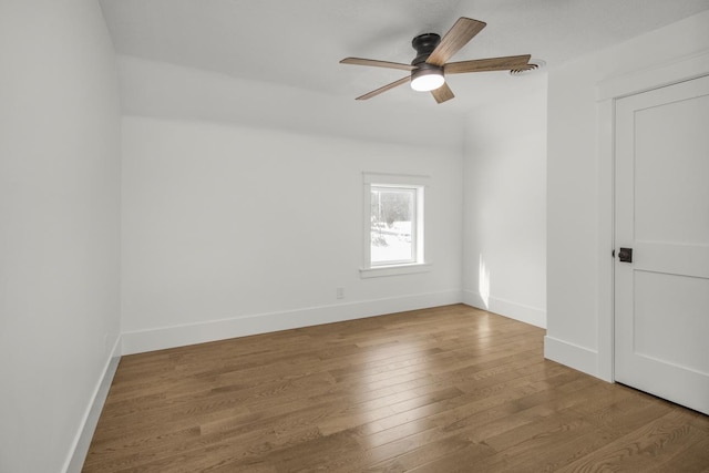 unfurnished room featuring ceiling fan and hardwood / wood-style floors