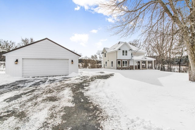 view of snow covered exterior featuring a porch