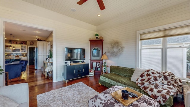 living room featuring dark wood-style floors, wood ceiling, and a ceiling fan