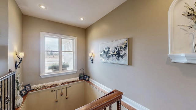 stairway with recessed lighting and baseboards