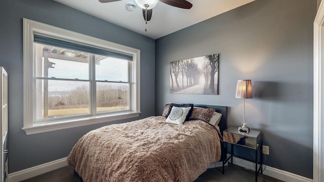 bedroom with carpet flooring and baseboards