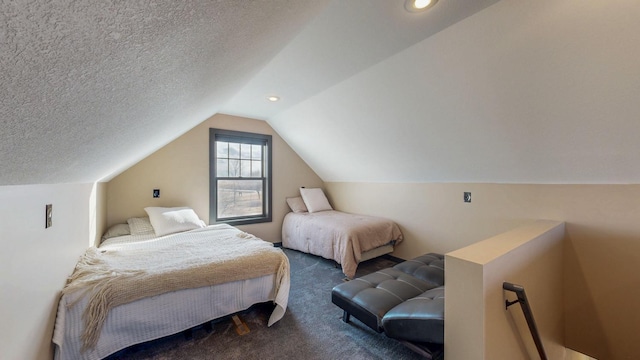 bedroom with carpet, vaulted ceiling, and a textured ceiling