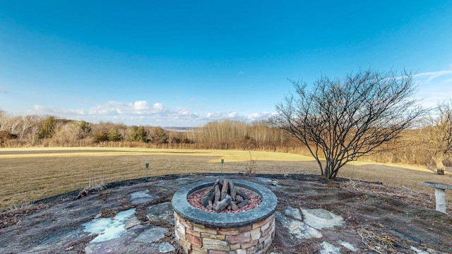 view of patio / terrace with an outdoor fire pit