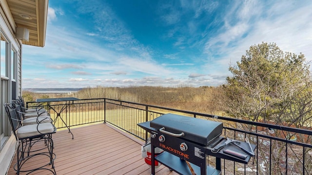 wooden terrace featuring grilling area