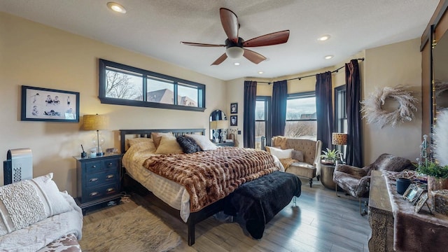 bedroom featuring ceiling fan, recessed lighting, and wood finished floors