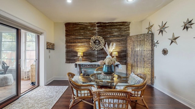 dining room with baseboards, recessed lighting, and wood finished floors