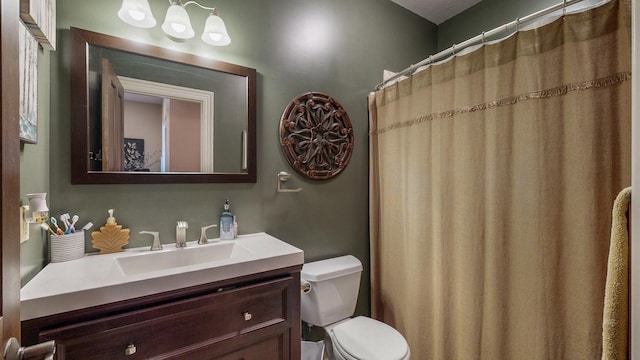 bathroom with toilet and vanity