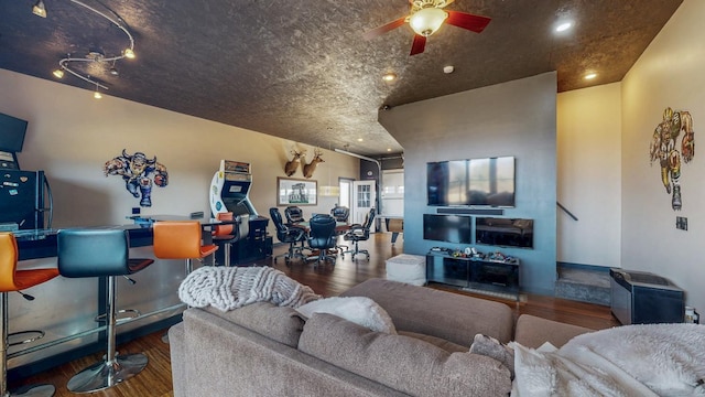 living room featuring wood finished floors, ceiling fan, and recessed lighting