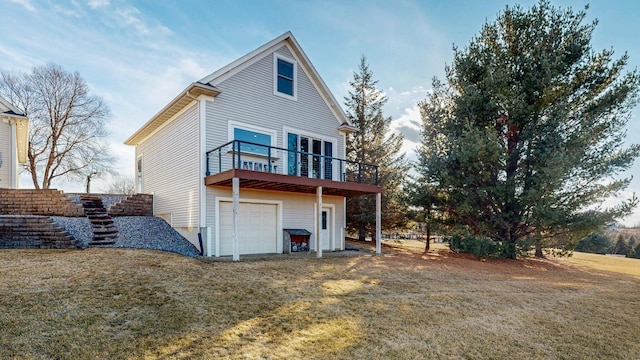 rear view of house with a garage and a lawn