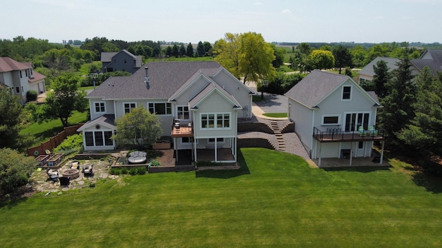30150 715th St, Lake City, MN 55041 - back of house with a fire pit, a deck, a lawn, and stairs