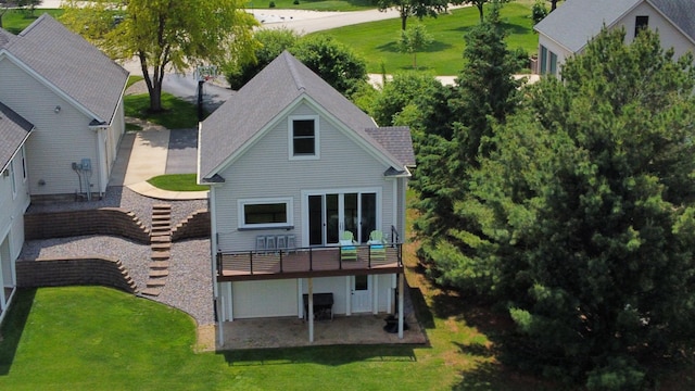 30150 715th St, Lake City, MN 55041 - rear view of property featuring a lawn, a garage, and a deck
