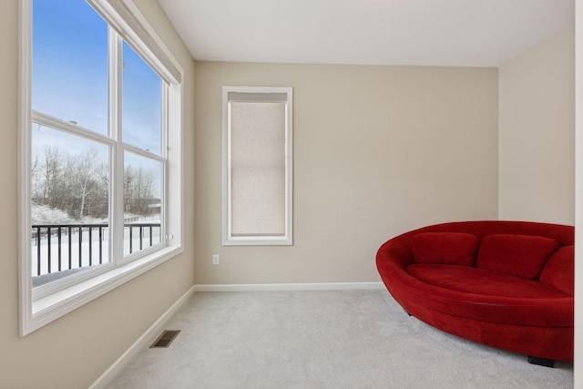 sitting room featuring carpet, visible vents, and baseboards