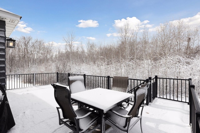 wooden terrace featuring outdoor dining space