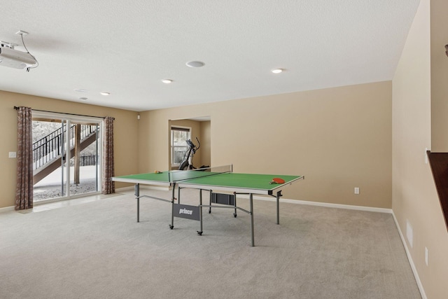 playroom with recessed lighting, light colored carpet, visible vents, a textured ceiling, and baseboards