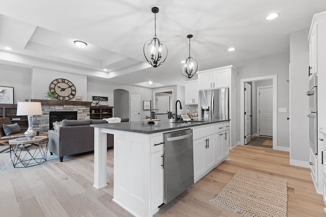 22816 Jarvis St NW, Elk River, MN 55330 - kitchen with pendant lighting, appliances with stainless steel finishes, sink, and white cabinets