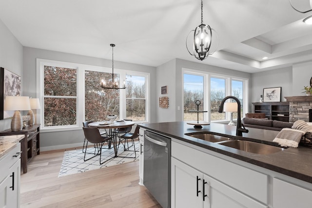 22816 Jarvis St NW, Elk River, MN 55330 - kitchen with an inviting chandelier, dishwasher, sink, and white cabinets