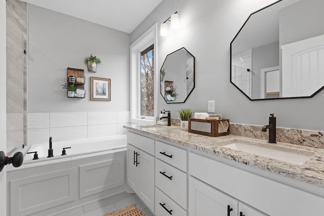 22816 Jarvis St NW, Elk River, MN 55330 - bathroom featuring vanity, tile patterned floors, and a bathing tub