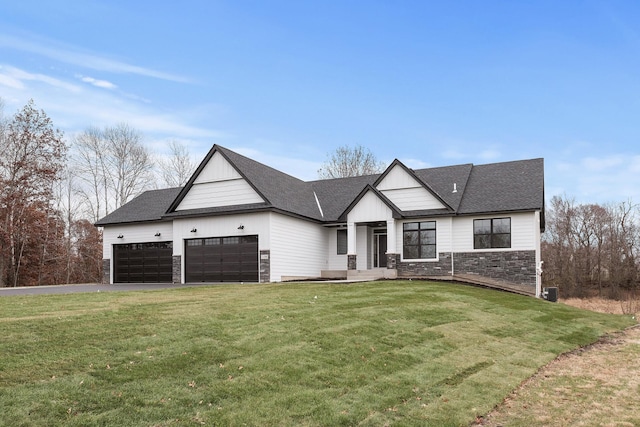 22816 Jarvis St NW, Elk River, MN 55330 - view of front facade featuring a garage and a front yard