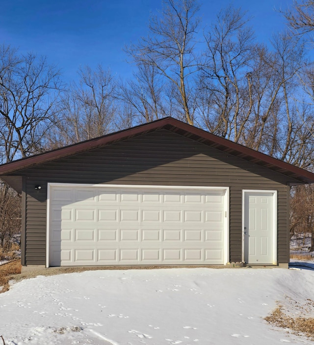 view of snow covered garage